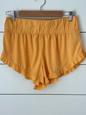 FP Movement by Free People Golden Yellow Ruffle Hem Athletic Shorts